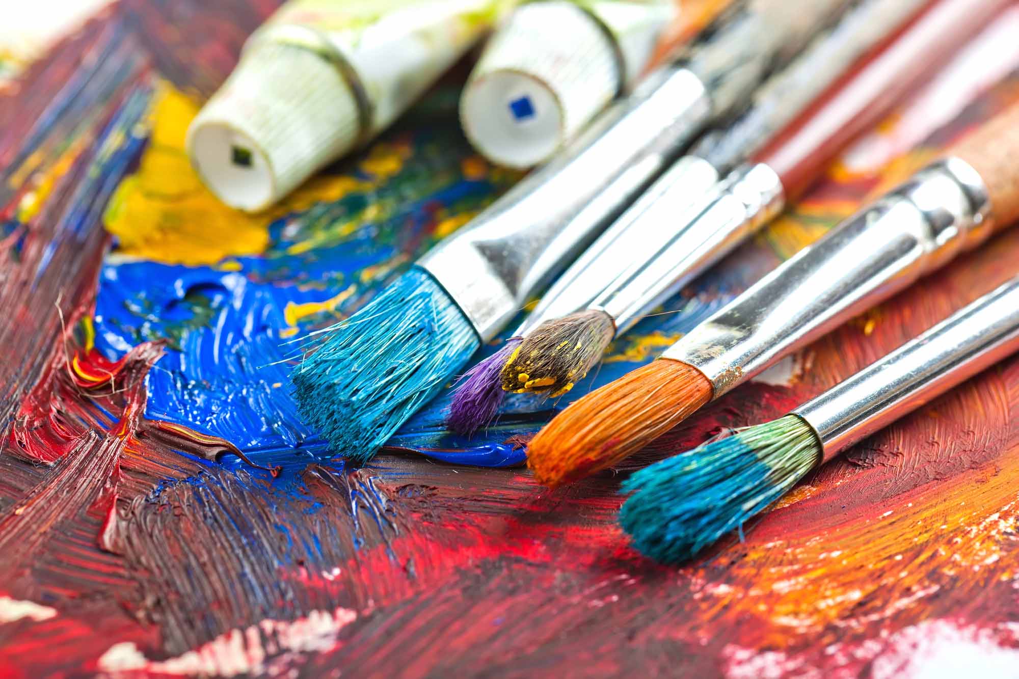 Paintbrushes and paint on a palette